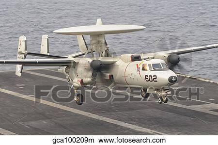 An E-2C Hawkeye landing on the flight deck of USS George H. W. Bush. View Large Photo Image Picture - An E-2C Hawkeye landing on the flight deck of USS George H. W. Bush.. Fotosearch