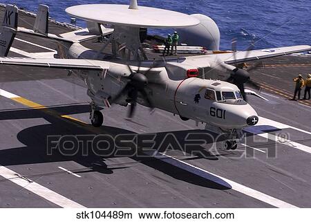 An E-2C Hawkeye lands aboard aircraft carrier USS Ronald Reagan. View Large Photo Image Picture - An E-2C Hawkeye lands aboard aircraft carrier USS Ronald Reagan.. Fotosearch