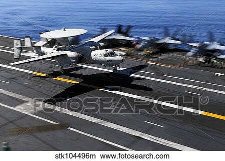 An E-2C Hawkeye lands aboard the aircraft carrier USS John C. Stennis. View Large Photo Image Picture - An E-2C Hawkeye lands aboard the aircraft carrier USS John C. Stennis.. Fotosearch