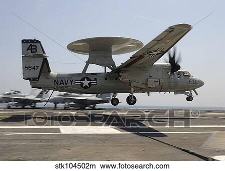 Picture - An E-2C Hawkeye lands aboard the aircraft carrier USS Enterprise.. Fotosearch