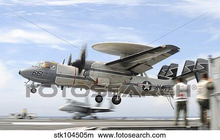 An E-2C Hawkeye lands aboard the aircraft carrier USS George H. W. Bush. View Large Photo Image Picture - An E-2C Hawkeye lands aboard the aircraft carrier USS George H. W. Bush.. Fotosearch