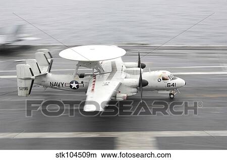 An E-2C Hawkeye lands aboard the aircraft carrier USS Harry S. Truman. View Large Photo Image Picture - An E-2C Hawkeye lands aboard the aircraft carrier USS Harry S. Truman.. Fotosearch