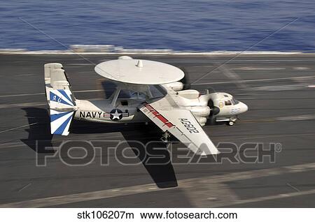 An E-2C Hawkeye lands aboard the aircraft carrier USS Dwight D. Eisenhower. View Large Photo Image Picture - An E-2C Hawkeye lands aboard the aircraft carrier USS Dwight D. Eisenhower.. Fotosearch