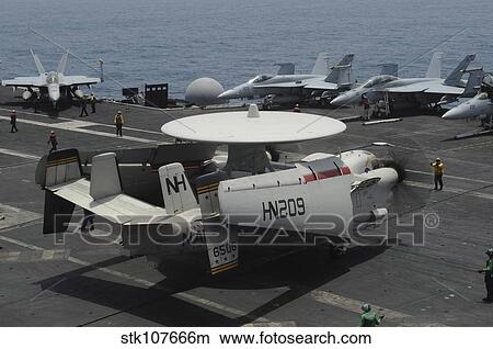 An E-2C Hawkeye lands on the flight deck of USS Nimitz. View Large Photo Image Picture - An E-2C Hawkeye lands on the flight deck of USS Nimitz.. Fotosearch