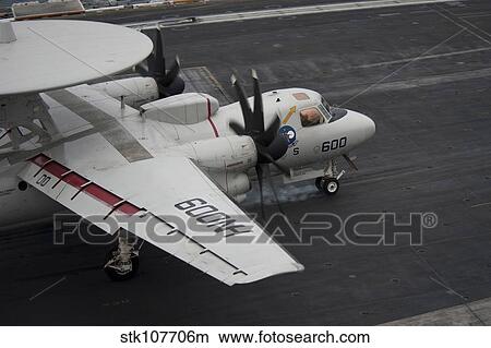 Picture - An E-2C Hawkeye lands on the flight deck of USS Nimitz.. Fotosearch