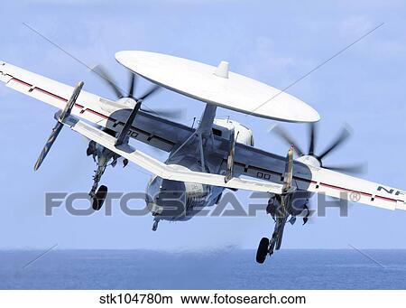 Picture - An E-2C Hawkeye launches from the aircraft carrier USS George Washington.. Fotosearch