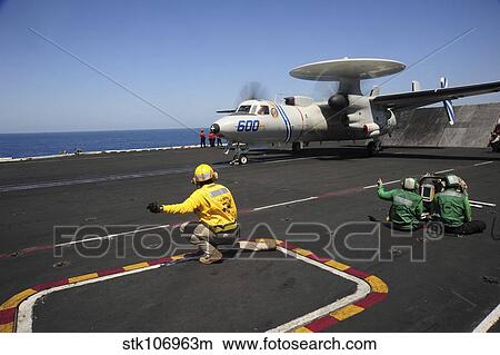 An E-2C Hawkeye launches from the flight deck of USS Dwight D. Eisenhower. View Large Photo Image Picture - An E-2C Hawkeye launches from the flight deck of USS Dwight D. Eisenhower.. Fotosearch