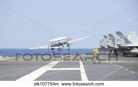 An E-2C Hawkeye launches from the flight deck of USS Harry S. Truman. View Large Photo Image Picture - An E-2C Hawkeye launches from the flight deck of USS Harry S. Truman.. Fotosearch