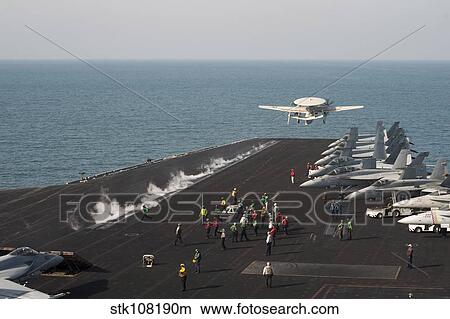 An E-2C Hawkeye launches from the flight deck of USS Harry S. Truman. View Large Photo Image Picture - An E-2C Hawkeye launches from the flight deck of USS Harry S. Truman.. Fotosearch