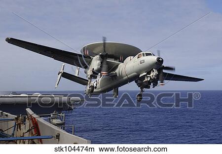 An E-2C Hawkeye launches from USS Kitty Hawk. View Large Photo Image Picture - An E-2C Hawkeye launches from USS Kitty Hawk.. Fotosearch