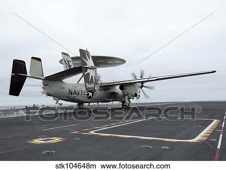 An E-2C Hawkeye launches off the flight deck of USS Abraham Lincoln. View Large Photo Image Picture - An E-2C Hawkeye launches off the flight deck of USS Abraham Lincoln.. Fotosearch