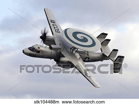 An E-2C Hawkeye performs a fly-by during an air power demonstration. View Large Photo Image Picture - An E-2C Hawkeye performs a fly-by during an air power demonstration.. Fotosearch