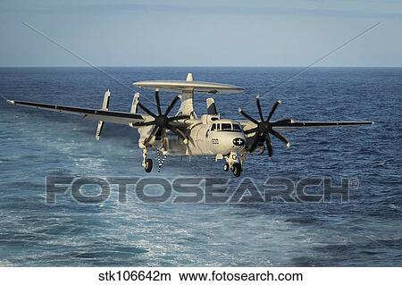 An E-2C Hawkeye prepares to land. View Large Photo Image Picture - An E-2C Hawkeye prepares to land.. Fotosearch
