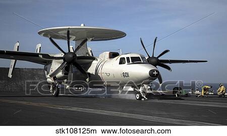 An E-2C Hawkeye prepares to launch from the flight deck of USS Nimitz. View Large Photo Image Picture - An E-2C Hawkeye prepares to launch from the flight deck of USS Nimitz.. Fotosearch