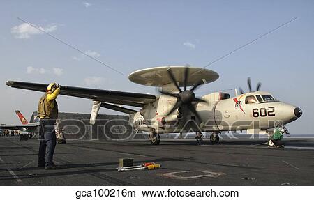 An E-2C Hawkeye ready to launch from the deck of USS George H. W. Bush. View Large Photo Image Picture - An E-2C Hawkeye ready to launch from the deck of USS George H. W. Bush.. Fotosearch