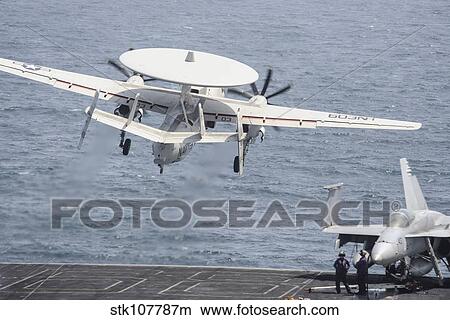 Picture - An E-2C Hawkeye takes off from the flight deck of USS Nimitz.. Fotosearch