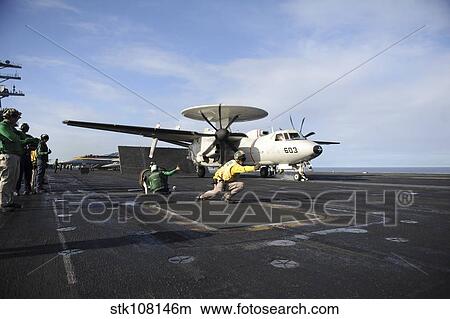 An E2-C Hawkeye prepares to launch from the flight deck of USS Nimitz. View Large Photo Image Picture - An E2-C Hawkeye prepares to launch from the flight deck of USS Nimitz.. Fotosearch