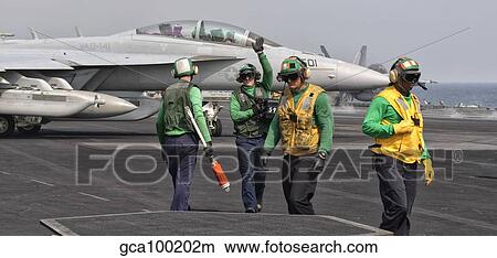 An EA-18G Growler is guided into catapult aboard USS George H. W. Bush. View Large Photo Image Picture - An EA-18G Growler is guided into catapult aboard USS George H. W. Bush.. Fotosearch