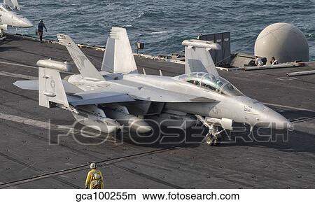An EA-18G Growler is guided into catapult aboard USS George H. W. Bush. View Large Photo Image Picture - An EA-18G Growler is guided into catapult aboard USS George H. W. Bush.. Fotosearch
