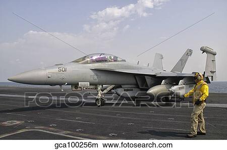 An EA-18G Growler is guided into catapult aboard USS George H. W. Bush. View Large Photo Image Picture - An EA-18G Growler is guided into catapult aboard USS George H. W. Bush.. Fotosearch