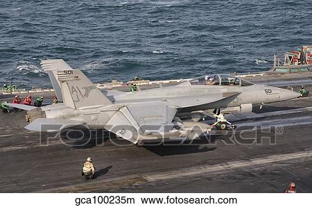 An EA-18G Growler is ready for a mission aboard USS George H. W. Bush. View Large Photo Image Picture - An EA-18G Growler is ready for a mission aboard USS George H. W. Bush.. Fotosearch