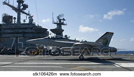 Picture - An EA-18G Growler lands aboard the aircraft carrier USS Harry S. Truman.. Fotosearch
