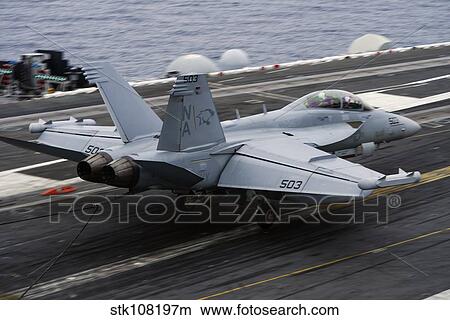 An EA-18G Growler lands on the flight deck of USS Carl Vinson. View Large Photo Image Picture - An EA-18G Growler lands on the flight deck of USS Carl Vinson.. Fotosearch