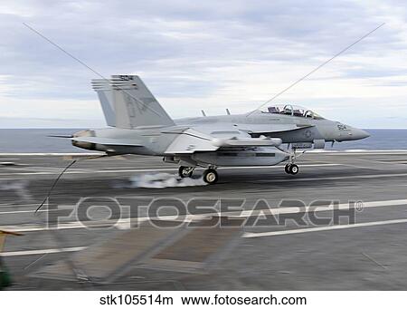 An E/A-18G Growler makes an arrested landing aboard USS George H. W. Bush. View Large Photo Image Picture - An E/A-18G Growler makes an arrested landing aboard USS George H. W. Bush.. Fotosearch