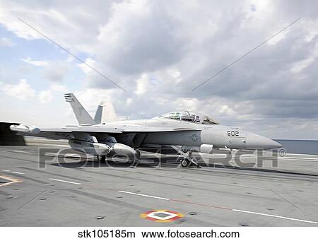 An EA-18G Growler takes off from USS George H. W. Bush. View Large Photo Image Picture - An EA-18G Growler takes off from USS George H. W. Bush.. Fotosearch