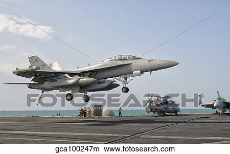 An EA-18G Growler trap landing on the flight deck of USS George H. W. Bush. View Large Photo Image Picture - An EA-18G Growler trap landing on the flight deck of USS George H. W. Bush.. Fotosearch