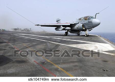 An EA-6B Prowler catapults from the aircraft carrier USS Ronald Reagan. View Large Photo Image Picture - An EA-6B Prowler catapults from the aircraft carrier USS Ronald Reagan.. Fotosearch