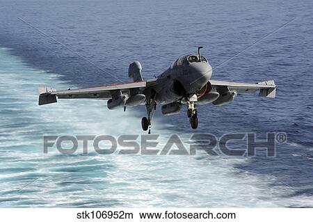 An EA-6B Prowler lands aboard the aircraft carrier USS John C. Stennis. View Large Photo Image Picture - An EA-6B Prowler lands aboard the aircraft carrier USS John C. Stennis.. Fotosearch