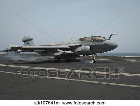 An EA-6B Prowler lands on the flight deck of USS Nimitz. View Large Photo Image Picture - An EA-6B Prowler lands on the flight deck of USS Nimitz.. Fotosearch