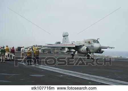 An EA-6B Prowler lands on the flight deck of USS Nimitz. View Large Photo Image Picture - An EA-6B Prowler lands on the flight deck of USS Nimitz.. Fotosearch