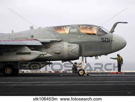 An EA-6B Prowler prepares to launch from the flight deck of USS Abraham Lincoln. View Large Photo Image Picture - An EA-6B Prowler prepares to launch from the flight deck of USS Abraham Lincoln.. Fotosearch