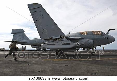 Picture - An EA-6B Prowler prepares to launch from the flight deck of USS Enterprise.. Fotosearch