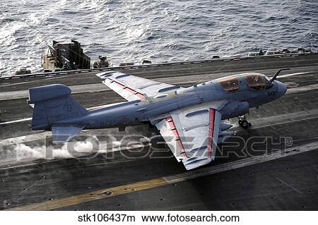 An EA-6B Prowler takes off from the aircraft carrier USS Enterprise. View Large Photo Image Picture - An EA-6B Prowler takes off from the aircraft carrier USS Enterprise.. Fotosearch