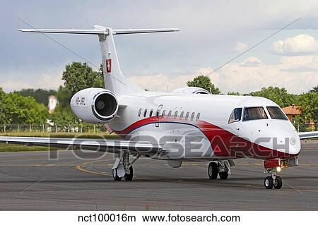 Picture - An Embraer Legacy 600 private jet taxiing at Turin Airport, Italy.. Fotosearch