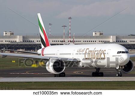 An Emirates Boeing 777 at Milano Malpensa Airport, Italy. View Large Photo Image Picture - An Emirates Boeing 777 at Milano Malpensa Airport, Italy.. Fotosearch