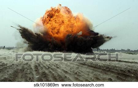 An explosion erupts from the detonation of a weapons cache. View Large Photo Image Picture - An explosion erupts from the detonation of a weapons cache.. Fotosearch