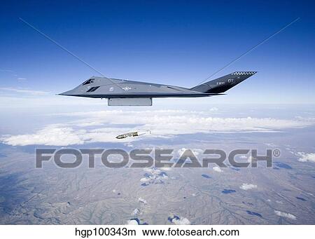 An F-117 Nighthawk releases a GBU-31 JDAM. View Large Photo Image Picture - An F-117 Nighthawk releases a GBU-31 JDAM.. Fotosearch
