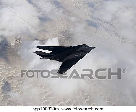An F-117 Nighthawk stealth fighter in flight over New Mexico. View Large Photo Image Picture - An F-117 Nighthawk stealth fighter in flight over New Mexico.. Fotosearch