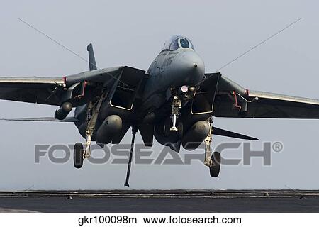 An F-14D Tomcat comes in for an arrested landing on the flight deck of USS Theodore Roosevelt. View Large Photo Image Picture - An F-14D Tomcat comes in for an arrested landing on the flight deck of USS Theodore Roosevelt.. Fotosearch