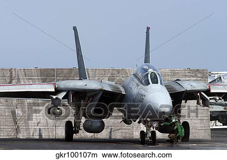 An F-14D Tomcat in launch position on the flight deck of USS Theodore Roosevelt. View Large Photo Image Picture - An F-14D Tomcat in launch position on the flight deck of USS Theodore Roosevelt.. Fotosearch