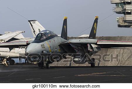 An F-14D Tomcat in launch position on the flight deck of USS Theodore Roosevelt. View Large Photo Image Picture - An F-14D Tomcat in launch position on the flight deck of USS Theodore Roosevelt.. Fotosearch