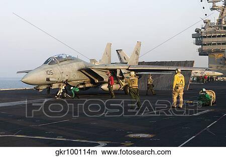 Picture - An F-14D Tomcat in launch position on the flight deck of USS Theodore Roosevelt.. Fotosearch