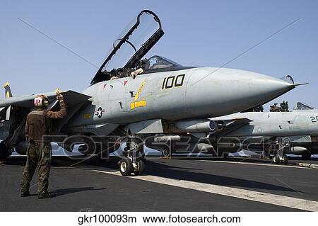 An F-14D Tomcat on the flight deck of USS Theodore Roosevelt. View Large Photo Image Picture - An F-14D Tomcat on the flight deck of USS Theodore Roosevelt.. Fotosearch