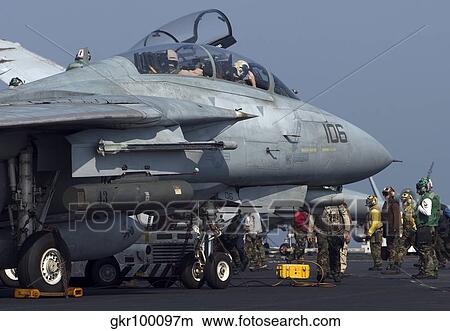 An F-14D Tomcat on the flight deck of USS Theodore Roosevelt. View Large Photo Image Picture - An F-14D Tomcat on the flight deck of USS Theodore Roosevelt.. Fotosearch