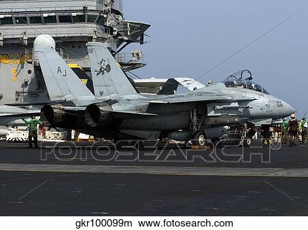 An F-14D Tomcat on the flight deck of USS Theodore Roosevelt. View Large Photo Image Picture - An F-14D Tomcat on the flight deck of USS Theodore Roosevelt.. Fotosearch