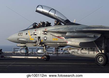 An F-14D Tomcat on the flight deck of USS Theodore Roosevelt. View Large Photo Image Picture - An F-14D Tomcat on the flight deck of USS Theodore Roosevelt.. Fotosearch